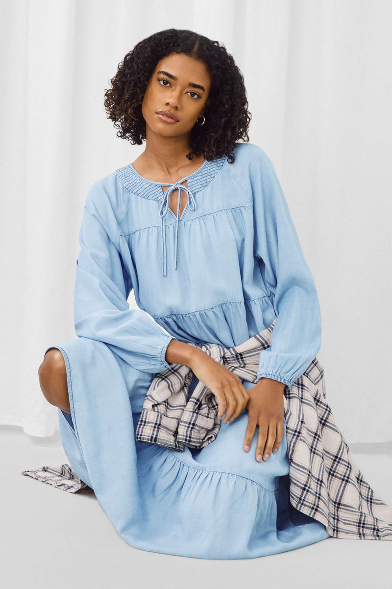 HY5348 Dark Denim Womens Smock Detail Tie Neck Long Sleeve Tencel Dress Pose